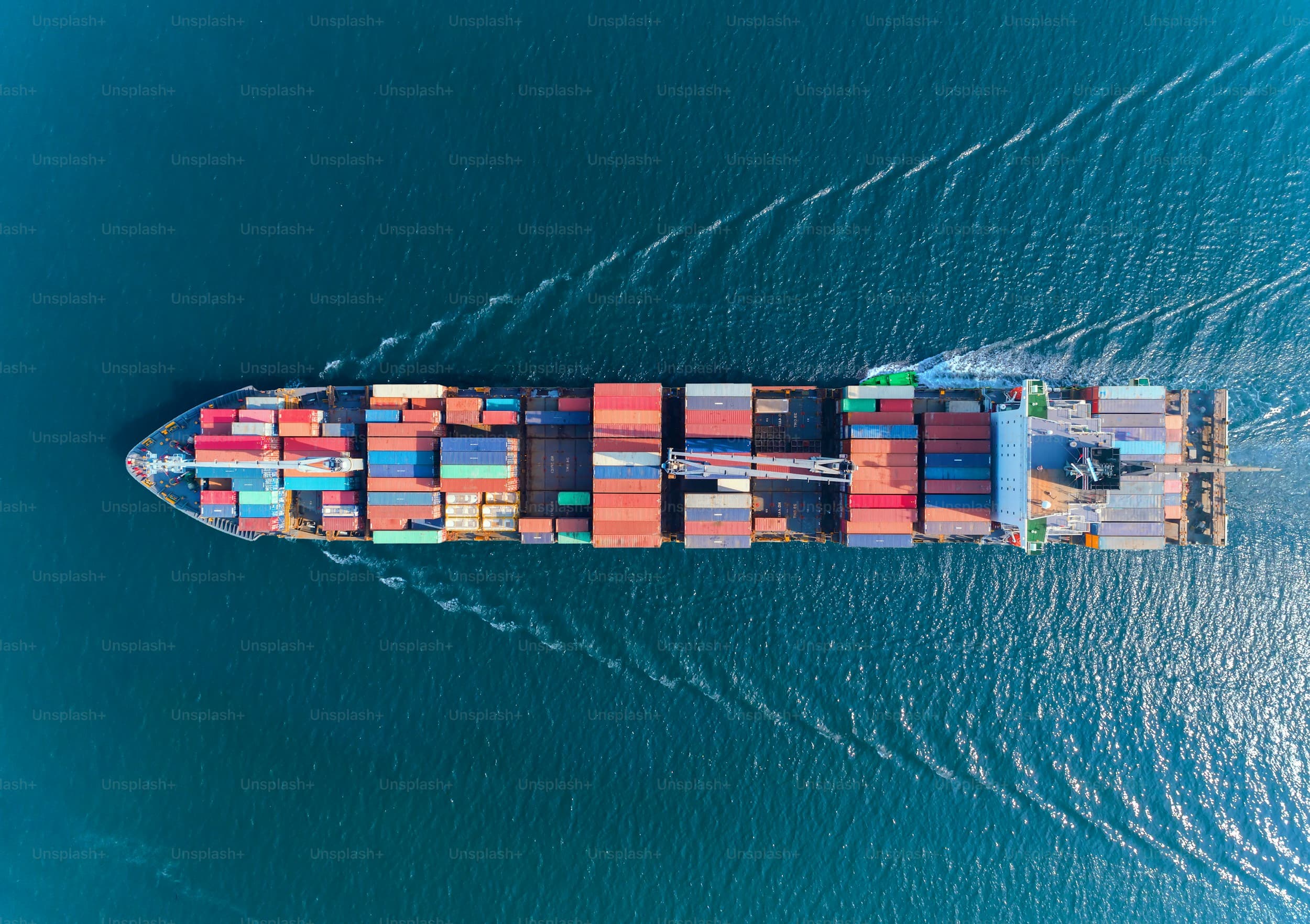 Cargo ship with containers from aerial view